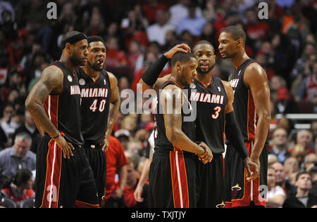 Miami Heat's LeBron James (L-R), Udonis Haslem, Mario Chalmers, Dwyane Wade and Chris Bosh stand on the floor during a timeout in the third quarter of Game 4 of the NBA Eastern Conference Semifinals  against the Chicago Bulls during the 2013 NBA Playoffs at the United Center in Chicago on May 13, 2013. The Heat won 88-65 and lead the best of seven series 3-1.     UPI/Brian Kersey Stock Photo