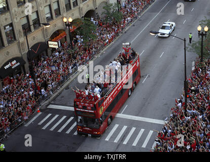 Jun 11, 2010 - Chicago, Illinois, U.S. - Fan carries fake Stanley cup on  Wacker Drive. Parade on Michigan Avenue to celebrate the Stanley Cup 2010  championship win of the Chicago Blackhawks