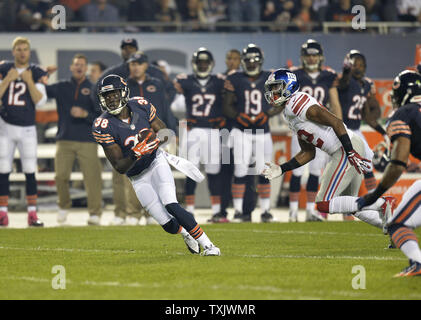 Chicago Bears cornerback Zack Bowman (L) brings down Minnesota