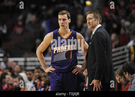 Phoenix Suns head coach Jeff Hornacek (R) talks with guard Goran Dragic during the fourth quarter at the United Center in Chicago on January 7, 2014. The Bulls defeated the Suns 92-87.       UPI/Brian Kersey Stock Photo