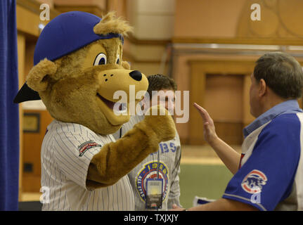 Clark, the Chicago Cubs mascot, wears a rainbow sleeve as he prepares to  catch ceremonial first pitches at Pride Night before a baseball game  between the Cubs and the Pittsburgh Pirates on