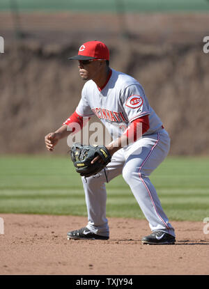 Cincinnati Reds second baseman Santiago Espinal looks to throw during a ...
