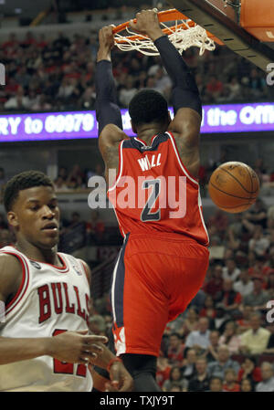 Chicago Bulls guard Jimmy Butler (21) passes out from underneath the ...