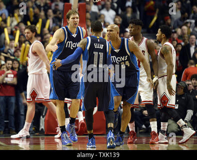 Dallas Mavericks forward Dirk Nowitzki (L) and forward Richard Jefferson (R) congratulate guard Monta Ellis after Ellis sunk three consecutive free throws to tie the game late in the fourth quarter against the Chicago Bulls at the United Center on December 2, 2014 in Chicago. The Mavericks defeated the Bulls 132-129 in double overtime.     UPI/Brian Kersey Stock Photo