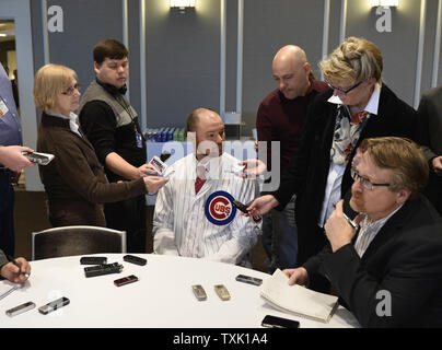 Chicago Cubs new starting pitcher Jon Lester poses for photos with