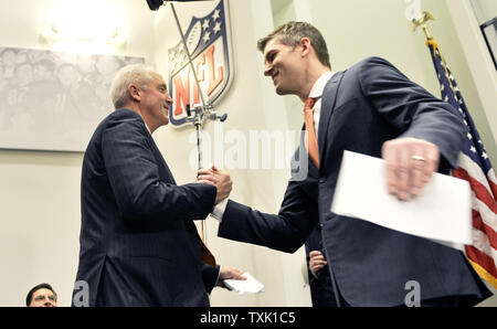 Chicago Bears new head coach John Fox (L) shakes hands with general manager Ryan Pace after Pace introduced him at a news conference at Halas Hall on January 19, 2015 in Lake Forest, Illinois.     UPI/Brian Kersey Stock Photo