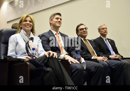 Robin Fox (L-R) sits with Chicago Bears general manager Ryan Pace (L-R), president Ted Phillips and chairman George McCaskey as her husband, new Bears head coach John Fox, speaks during his introductory news conference at Halas Hall on January 19, 2015 in Lake Forest, Illinois.     UPI/Brian Kersey Stock Photo