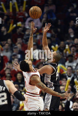 San Antonio Spurs guard Tony Parker (R) goes up for a shot as Chicago Bulls guard Derrick Rose  defends during the third quarter at the United Center in Chicago on January 22, 2015. The Bulls defeated the Spurs 104-81.    UPI/Brian Kersey Stock Photo
