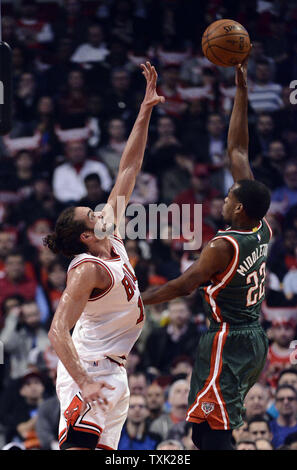 Milwaukee Bucks guard Khris Middleton shoots over Chicago Bulls center Joakim Noah during the first quarter of game 2 the first round of the NBA Playoffs at the United Center on April 20, 2015 in Chicago.     Photo by Brian Kersey/UPI Stock Photo