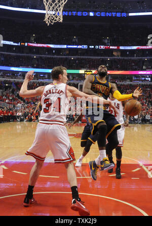 Cleveland Cavaliers guard Kyrie Irving (2) is defended by Chicago Bulls forward Mike Dunleavy (34) during the first half of game 4 of the Eastern Conference Semifinals of the NBA Playoffs at the United Center on May 10, 2015 in Chicago.   Photo by David Banks/UPI Stock Photo