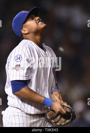 Chicago Cubs second baseman Starlin Castro winces after colliding with shortstop Javier Baez on a grounder by New York Mets Curtis Granderson in the sixth inning of game 4 of the National League Championship Series at Wrigley Field in Chicago on October 21, 2015.    Photo by Brian Kersey/UPI Stock Photo