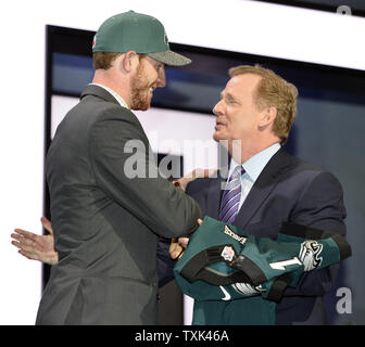 North Dakota State quarterback Carson Wentz (L) shakes hands with NFL Commissioner Roger Goodell after being selected by the Philadelphia Eagles with the second overall pick in the 2016 NFL Draft on April 28, 2016 in Chicago.     Photo by Brian Kersey/UPI Stock Photo