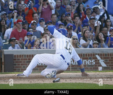 Chicago Cubs second baseman Ben Zobrist (18) scores against the Los Angeles Dodgers during the fifth inning at Wrigley Field in Chicago on May, 30, 2016. Photo by Kamil Krzaczynski/UPI Stock Photo