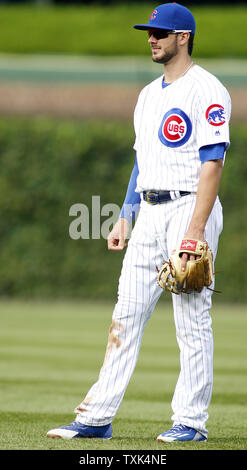 Chicago Cubs' Kris Bryant, right, rounds the bases after hitting a two ...