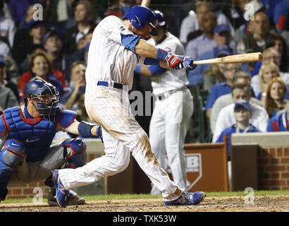 Chicago Cubs Ben Zobrist hits a double during the eighth inning against the Los Angeles Dodgers in game one of the National League Championship Series at Wrigley Field on October 15, 2016.  Photo by Kamil Krzaczynski/UPI Stock Photo