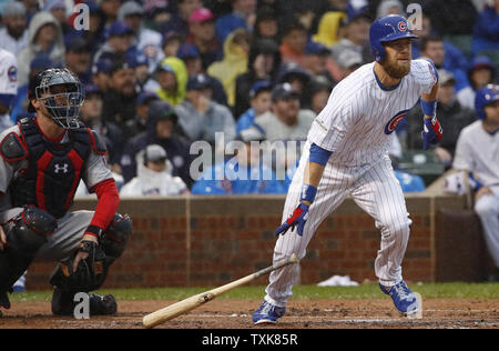 Chicago Cubs' Ben Zobrist hits a second inning double against the Washington Nationals during game 4 of the NLDS at Wrigley Field on October 11, 2017, in Chicago.    Photo by Kamil Krzaczynski/UPI Stock Photo