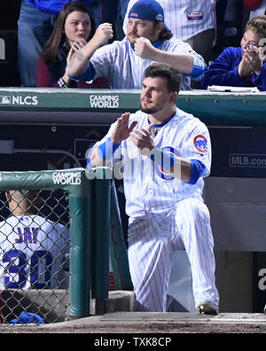 Chicago Cubs' Kyle Schwarber cheers for teammate Anthony Rizzo as he steps up to the plat during the second inning of game 4 of the NLCS against the Los Angeles Dodgers at Wrigley Field on October 18, 2017 in Chicago.     Photo by Brian Kersey/UPI Stock Photo