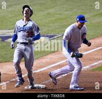 Los Angeles Dodgers' Cody Bellinger (L) and Chicago Cubs first baseman Anthony Rizzo react after Bellinger hit into a double play in the ninth inning to end game 4 of the NLCS at Wrigley Field on October 18, 2017 in Chicago. The Cubs defeated the Dodgers 3-2 but trail 3-1 in the best of seven series.     Photo by Brian Kersey/UPI Stock Photo