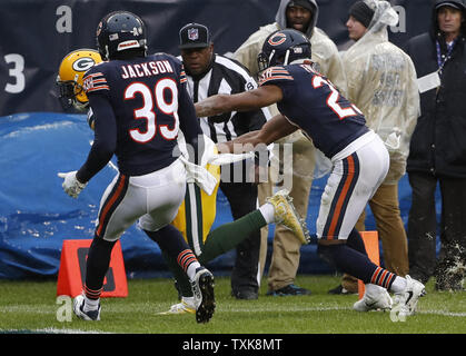 Chicago Bears safety Eddie Jackson (38) intercepts the football from  Cincinnati Bengals' A.J. Free (18) during the second half of play against  the Cincinnati Bengals at Paul Brown Stadium in Cincinnati, Ohio