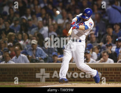 Chicago Cubs left fielder Ben Zobrist hits a double against the Cincinnati Reds in the third inning at Wrigley Field on September 14, 2018 in Chicago. Photo by Kamil Krzaczynski/UPI Stock Photo