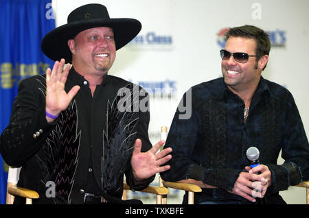 Country music duo Montgomery Gentry, made up of Eddie Montgomery, left, and Troy Gentry, announce their plans  to perform in January 2006 at 'Sound and Speed, A Celebration of Music & Motorsports' in Nashville, TN during a press conference prior to the UAW-GM 500 NASCAR Nextel Cup series race at the Lowe's Motor Speedway in Concord, NC on Oct. 15, 2005.  (UPI Photo/Nell Redmond) Stock Photo