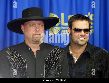 Country music duo Montgomery Gentry, made up of Eddie Montgomery, left, and Troy Gentry, announce their plans  to perform in January 2006 at 'Sound and Speed, A Celebration of Music & Motorsports' in Nashville, TN during a press conference prior to the UAW-GM 500 NASCAR Nextel Cup series race at the Lowe's Motor Speedway in Concord, NC on Oct. 15, 2005.  (UPI Photo/Nell Redmond) Stock Photo
