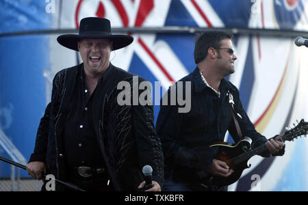 Eddie Montgomery, left, and Troy Gentry, better known as   the country rocker duo Montgomery Gentry, perform in concert prior to the start of the UAW-GM 500 NASCAR Nextel Cup series race at the Lowe's Motor Speedway in Concord, NC on Oct. 15, 2005.  (UPI Photo/Nell Redmond) Stock Photo