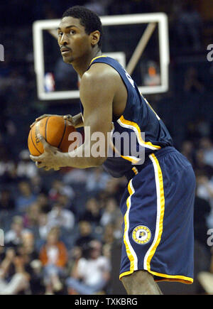 Indiana Pacers forward Ron Artest looks to pass against the Charlotte Bobcats at the Charlotte Bobcats Arena in Charlotte, N.C. on November 16, 2005. (UPI Photo/Nell Redmond) Stock Photo