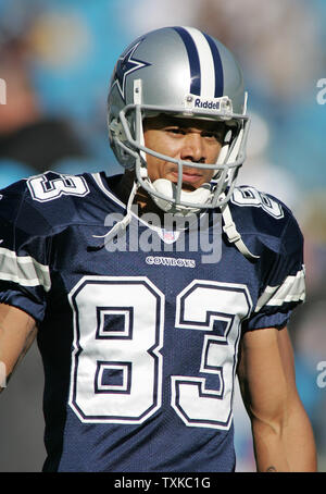 Dallas Cowboys wide receiver Terry Glenn covers up the ball after