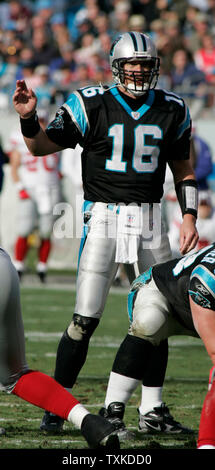 Carolina Panthers quarterback Chris Weinke (16) is downed by New York ...