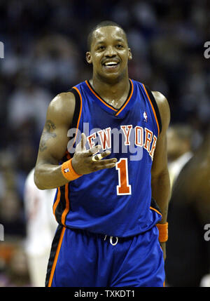 New York Knicks guard Steve Francis laughs as he walks to the bench during a timeout as the Knicks play the Charlotte Bobcats in the first half at the Charlotte Bobcats Arena in Charlotte, North Carolina on April 18, 2007. (UPI Photo/Nell Redmond) Stock Photo