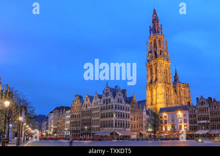 Night scene in downtown Antwerp, Belgium along the famous Meir Street and the lonely tower of the  Cathedral of our Lady. Stock Photo