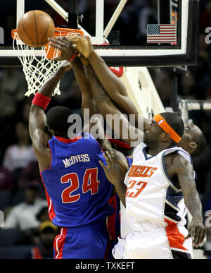 Detroit Pistons forward Antonio McDyess (24)  and Charlotte Bobcats guard Jason Richardson (23) battle for a rebound in the first half at the Charlotte Bobcats Arena in Charlotte, North Carolina on January 12, 2008. (UPI Photo/Nell Redmond) Stock Photo