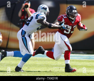 Carolina Panthers' Jon Beason (52), Chris Gamble (20), and Chris Harris ...