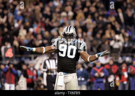 Carolina Panthers defensive end Julius Peppers (90) jokes with teammate  safety Nate Salley (25) prior to the opening kickoff on Sunday, December  21, 2008, at Giants Stadium in East Rutherford, New Jersey. (