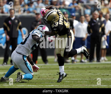 Carolina Panthers safety Sherrod Martin (23) catches New York Giants wide  receiver Mario Manningham (82) on a long catch and run during second half  NFL action in the New York Giants' 31-18