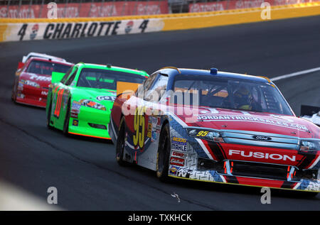 Cars race in the Coca-Cola 600 NASCAR Race at the Charlotte Motor Speedway in Concord, North Carolina on May 27, 2012.    UPI/Nell Redmond. Stock Photo