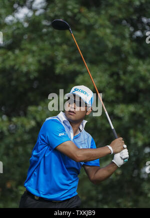 Hideki Matsuyama, of Japan, watches his shot on the 17th green during ...