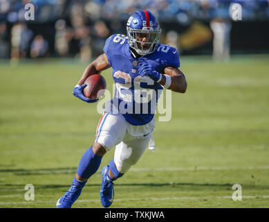 New York Giants running back Saquon Barkley carries the football for a  touchdown against the Carolina Panthers in the second half of an NFL  football game in Charlotte, North Carolina on October