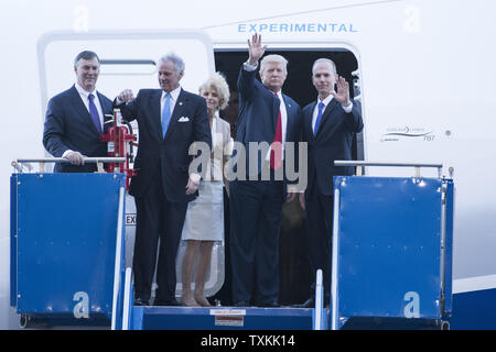 President Donald Trump stands with Boeing CEO Dennis Muilenburg, right, South Carolina Gov. Henry McMaster, left and Boeing Commercial Aircraft CEO Kevin McAllister as they board the new Boeing 787-10 Dreamliner aircraft at the Boeing factory in North Charleston, SC on February 17, 2016. The visit comes two days after workers at the South Carolina plant voted to reject union representation in a state where Trump won handily.   Photo by Richard Ellis/UPI Stock Photo