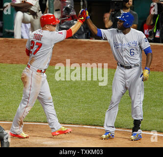 American League's Mike Trout (27) slides in safe ahead of the tag