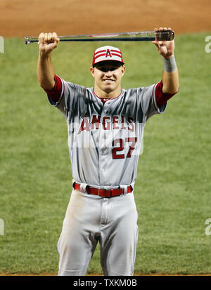 American League's Mike Trout (27) slides in safe ahead of the tag