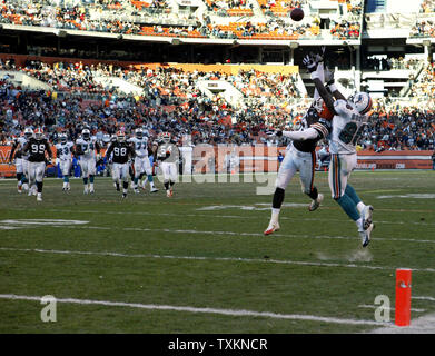 Cleveland Browns Leigh Bodden points to the sky as he celebrates his fourth  quarter interception with teammates, stopping the St. Louis Rams in the  last minute of the game at the Edward