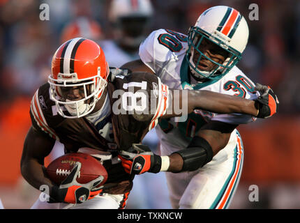 Cleveland Browns wide receiver Antonio Bryant (81) evades a tackle from Miami Dolphins safety Lance Schulters (30) in the third quarter Nov. 20, 2005, at Cleveland Browns Stadium.  The Browns defeated the Dolphins 22-0.  (UPI Photo/Scott R. Galvin) Stock Photo