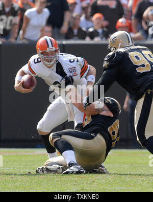 Cleveland Browns quarterback Charlie Frye (9) gets sacked for a