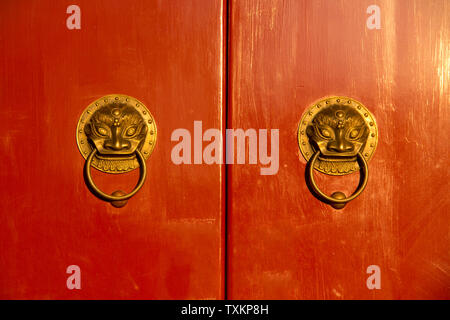 Red gate, golden door buckle. Stock Photo