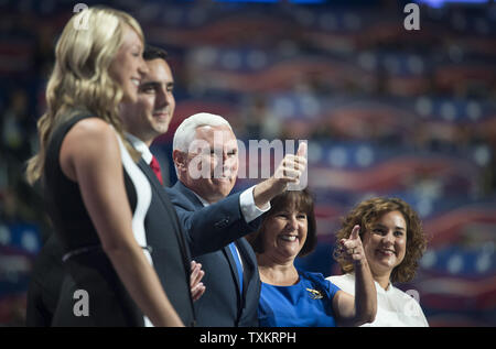 Indiana Governor and Republican vice-presidential candidate Mike Pence (C), his wife Karen (right center), and his family acknowledge the delegates applause after his acceptance speech at the Republican National Convention at Quicken Loans Arena in Cleveland, Ohio on July 20, 2016.   Donald Trump will formally accept the Republican Party's nomination for President on Thursday night July 21st.  Photo by Pete Marovich/UPI Stock Photo