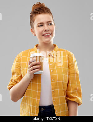 happy redhead teenage girl with paper coffee cup Stock Photo