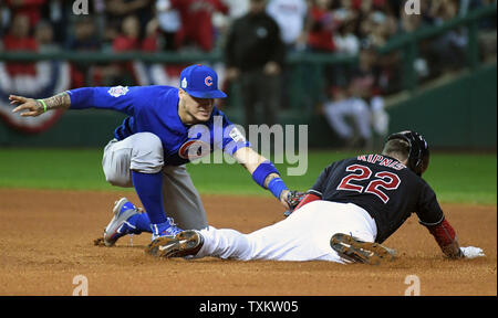 Chicago Cubs second baseman Javier Baez tags out Cleveland Indians  shortstop Francisco Lindor attempting to steal second base during the third  inning of game 1 of the World Series at Progressive Field