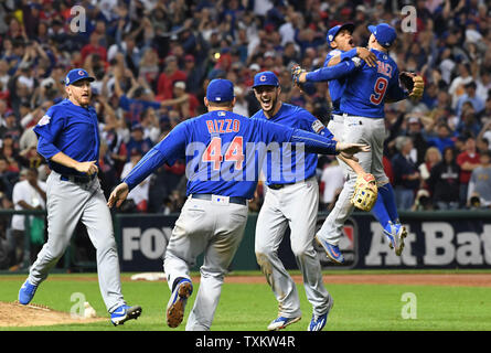 A color, born digital image of Kris Bryant #17 and Anthony Rizzo #44 of the  Chicago Cubs celebrating on the field after the Chicago Cubs defeat the  Washington Nationals during Game 5